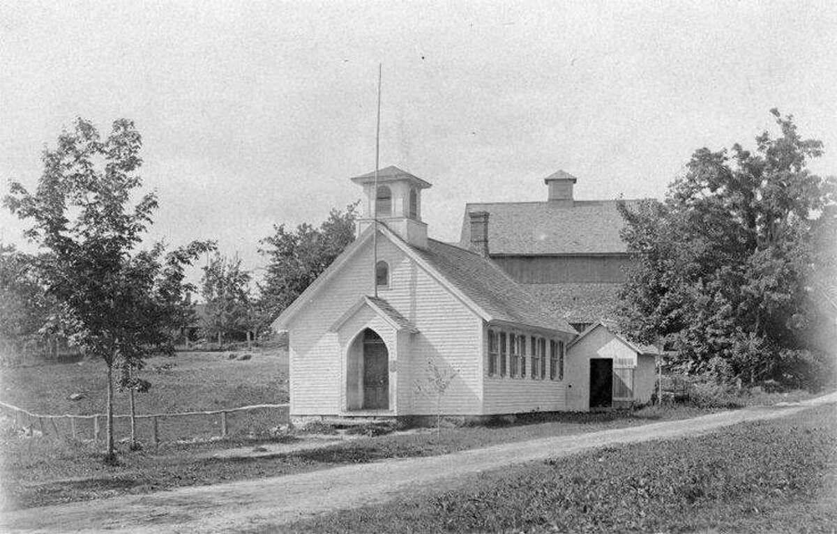 A photo of the North Canton Schoolhouse is part of an upcoming exhibit of the works of Lewis Mills.
