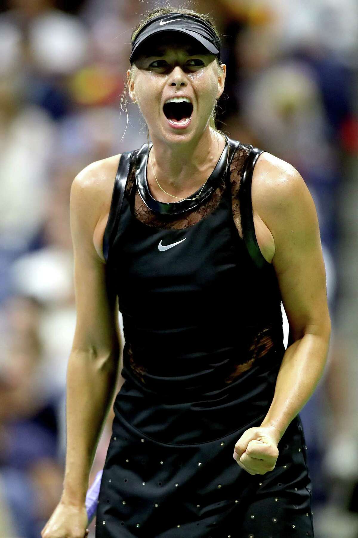 NEW YORK, NY - AUGUST 28: Maria Sharapova of Russia reacts during her first round Women's Singles match against Simona Halep of Romania on Day One of the 2017 US Open at the USTA Billie Jean King National Tennis Center on August 28, 2017 in the Flushing neighborhood of the Queens borough of New York City. (Photo by Matthew Stockman/Getty Images) ORG XMIT: 700042999