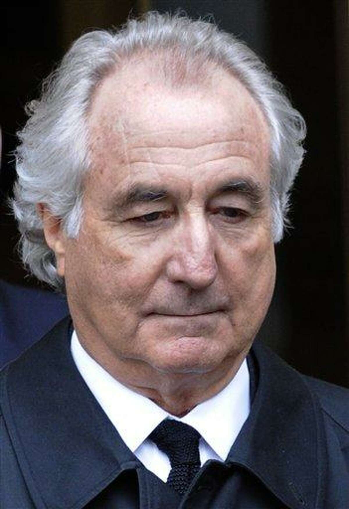 FILE - In this March 10, 2009 file photo, Bernard Madoff exits Manhattan federal court in New York. A law enforcement official tells The Associated Press that a son of Bernard Madoff has been found dead in New York City of an apparent suicide. The official says Mark Madoff was found hanged in his Manhattan apartment, Saturday, Dec. 11, 2010. (AP Photo/Louis Lanzano, file)