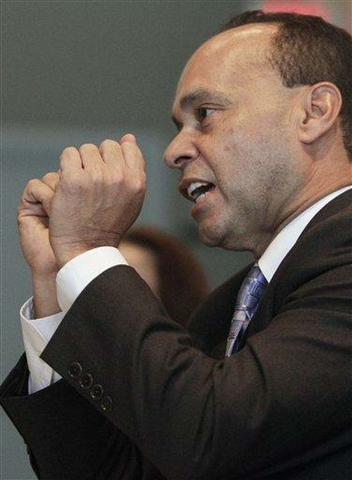 U.S. Rep. Luis Gutierrez describes how unsuspecting illegal immigrants are handcuffed when they show up for appointments with immigration officials in Mexico as he addresses the media along with Army National Guard Spc. Hector Nunez at a news conference, Monday, Dec. 6, 2010, in Chicago. Nunez is a 26-year-old native Chicagoan whose wife was brought to the U.S. illegally when she was six. After the two were married in 2005, she sought legal status, but was deported. Gutierrez says the case of the U.S. citizen soldier who's been separated from his illegal immigrant wife and U.S.-born child shows flaws in the immigration system. (AP Photo/M. Spencer Green)