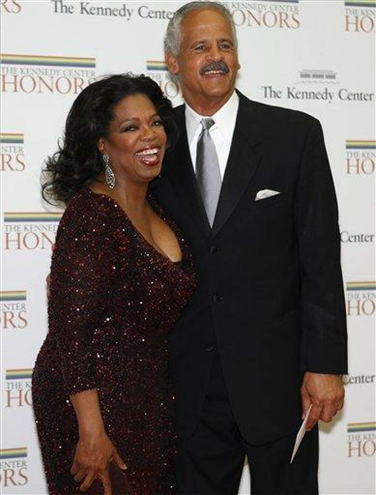 Oprah Winfrey and date Stedman Graham pose on the read carpet on arrival at a dinner held at the State Department honoring the recipients of the Kennedy Center Honors, in Washington, on Saturday, Dec. 4, 2010. The honorees are Winfrey, Merle Haggard, Jerry Herman, Bill T. Jones, and Paul McCartney. (AP Photo/Jacquelyn Martin)