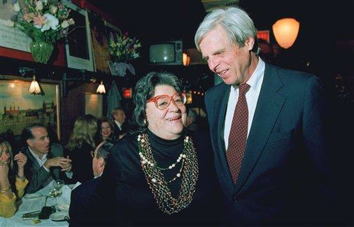 In this April 27, 1993 file photo, restaurateur Elaine Kaufman, left, stands with author George Plimpton at her restaurant "Elaine's" in New York. Kaufman, whose East Side establishment became a haven for show business and literary notables, died Friday, Dec. 3, 2010 at the age of 81.