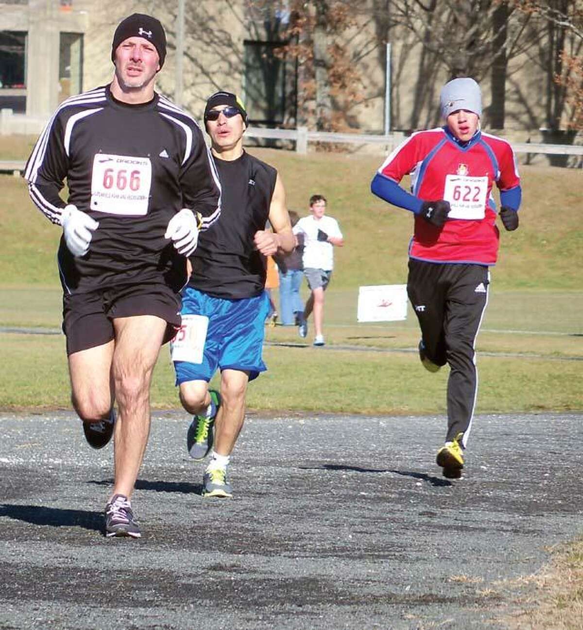RICKY CAMPBELL/ Register CitizenRunners battling the cold and the wind at the 28th year of the Jingle Bell Run on Dec. 4.