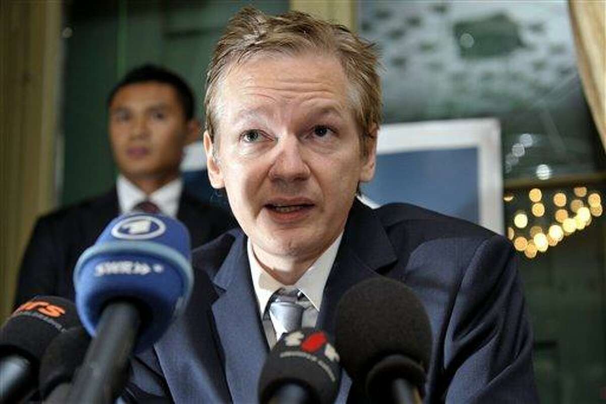 FILE - In this Nov. 4, 2010 file photo, Wikileaks founder Julian Assange speaks during a news conference at the Geneva press club, in Geneva, Switzerland. Assange is a former computer hacker who has embarrassed the U.S. government and foreign leaders with his online release of a huge trove of secret American diplomatic cables. (AP Photo/Keystone, Martial Trezzini, File)