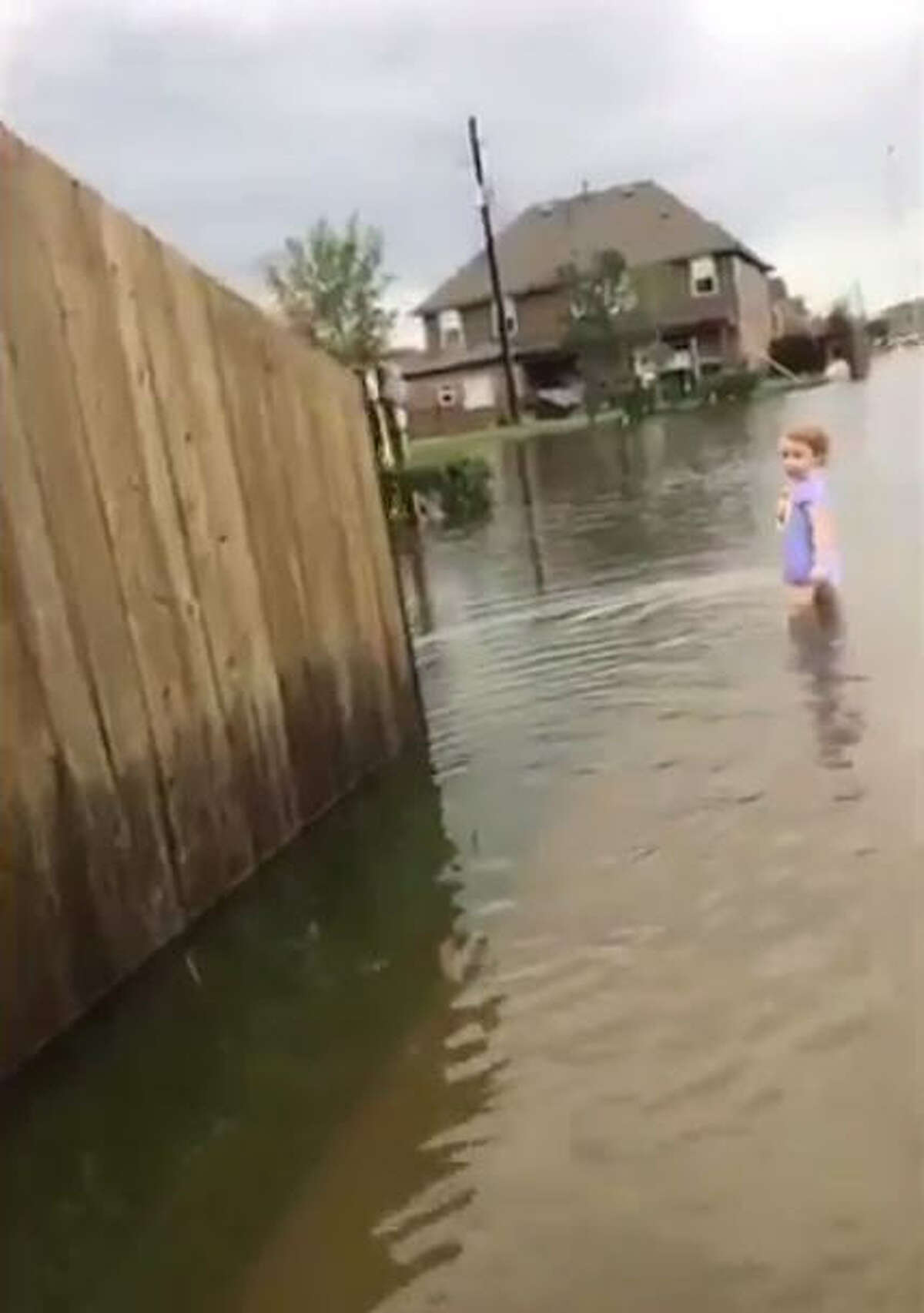 Videos taken by Pearland teen Renz Michael show a little girl in a diaper clutching her sippy cup wandering the flooded streets during Harvey. Keep going through the gallery to see other shocking photos of what the Houston area looks like during Harvey.Source: Twitter