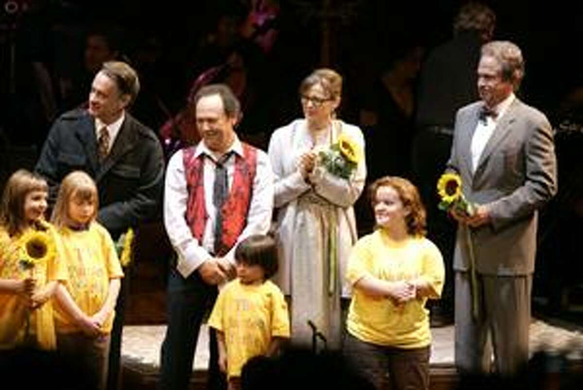 Children from The Painted Turtle camp join from left, Tom Hanks, Billy Crystal, Annette Bening and Warren Beatty listen as Bonnie Raitt sings a song in tribute to Paul Newman during the curtain call for the staged reading of "The World of Nick Adams," to benefit the Painted Turtle, Paul Newman's Hole in the Wall California Camp, at the Davies Symphony Hall in San Francisco, Monday, Oct. 27, 2008. The Painted Turtle is an innovative camp and family care center for children with life-threatening illnesses.(AP Photo/Eric Risberg)