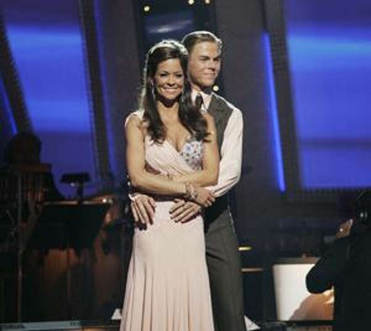 In this image provided by ABC-TV Brooke Burke and her partner Derek Hough are shown Tuesday Nov. 25, 2008. Burke waltzed away with the mirror ball trophy on the "Dancing with the Stars" finale. The 37-year-old TV personality and mother of four dominated the seventh season of the popular ABC dancing competition and bested former NFL player Warren Sapp and former 'NSync member Lance Bass during the Tuesday night finale, in which she reprised an emotional Viennese waltz routine that earned her a perfect score from the show's panel of judges. (AP Photo/ABC - KELSEY MCNEAL) BROOKE BURKE, DEREK HOUGH