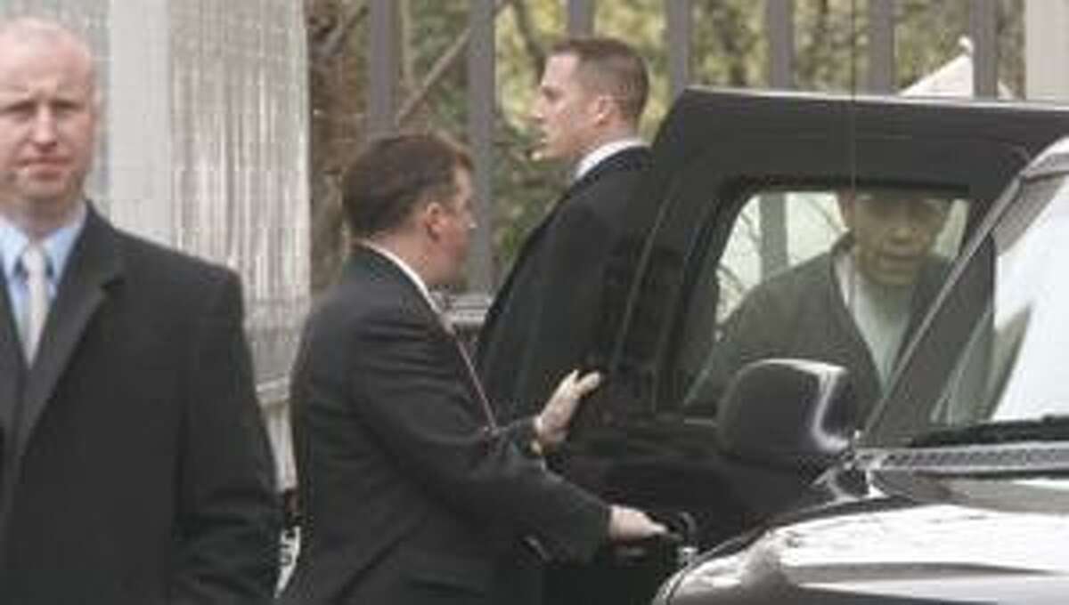 Surrounded by members of the Secret Service President-elect Barack Obama, right, boards his vehicle following his gym workout, Saturday, Nov. 15, 2008 in Chicago. (AP Photo/Pablo Martinez Monsivais)