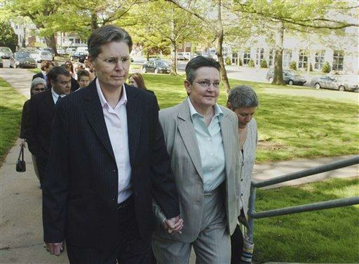 This May 14, 2007 file photo shows lesbian couple Janet Peck, left, and Carol Conklin holding hands as they lead a group of plaintiffs into the Connecticut State Supreme court in Hartford, Conn., Monday, May 14, 2007. The state Supreme Court ruled Friday, Oct. 10, 2008 that same-sex couples have the right to marry, making the state the third behind Massachusetts and California to legalize such unions. (AP Photo/Fred Beckham, file)