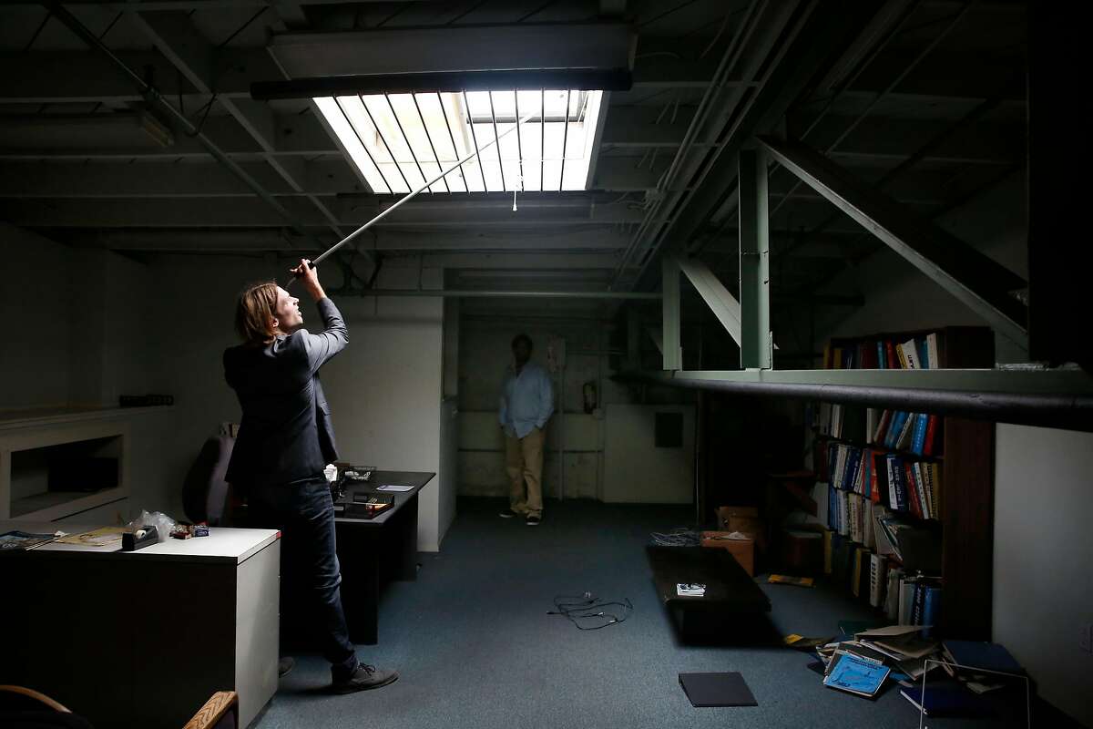 David Brown (l to r), president MESH Design Build Studio, checks out a skylight as Chip Moore, CEO 4&20 Blackbirds, , looks on in a warehouse purchased by Moore and his business partners on Tuesday, August 29, 2017 in Oakland, Calif. MESH Design Build Studio, the design firm hired to renovate a warehouse purchased by Chip Moore and his business partners.