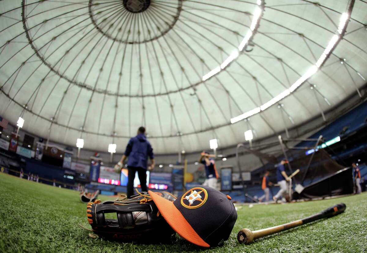 Houston Astros players take batting practice before a baseball game against the Texas Rangers Tuesday, Aug. 29, 2017, in St. Petersburg, Fla. The Astros moved their three game home series against the Rangers to St. Petersburg because of unsafe conditions from Hurricane Harvey. (AP Photo/Chris O'Meara)
