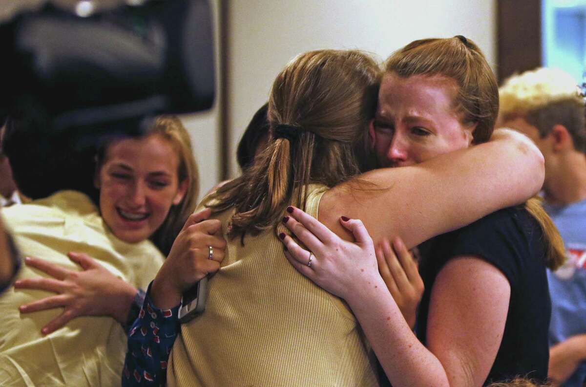Peyton Spriester,17, R,is hugged by fellow student Kathryn Courtney,16, after board voted to change the name of Robert E.Lee HS. On Tuesday evening, the North East ISD board will vote on whether to change the name of Robert E. Lee High School in the wake of the events in Charlottesville and the national debate it started about Confederate monuments. at NEISD board room on Tuesday, August 29,2017