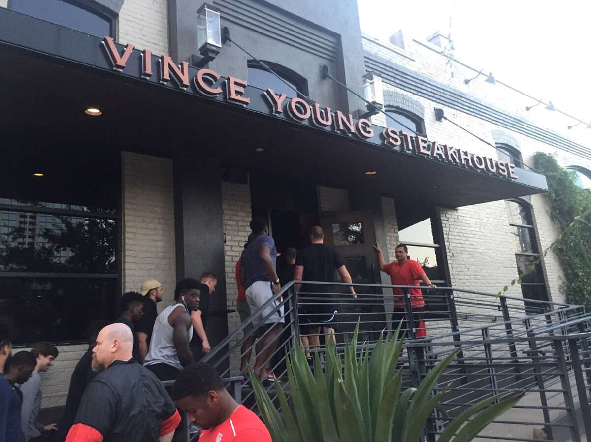 Vince Young hosted the University of Houston football team at his steakhouse in Austin on Tuesday.
