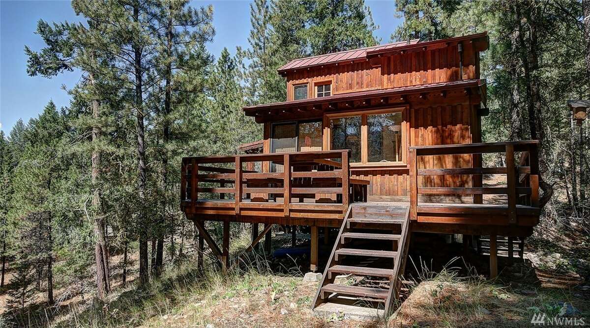 This cabin at 14 Homestead Rd. near Mazama is listed for $305,000. You can see the full listing here.