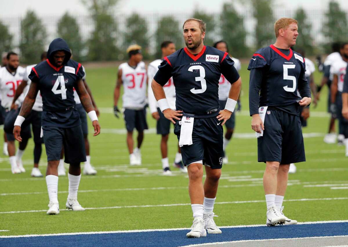 Houston Texans quarterbacks Deshaun Watson (4), Tom Savage (3) and Brandon Weeden (5) take a breather from running sprints during a morning practice at the Dallas Cowboys training facility, Monday, Aug. 28, 2017, in Frisco, Texas. The Texans are working out in the practice facility of the Dallas Cowboys because of floods pounding Houston. An exhibition game in the Texans' stadium Thursday might be moved to the home of the Cowboys. (AP Photo/Tony Gutierrez)