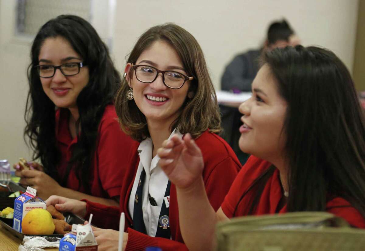Ruby Polanco,center ,a senior at the Young Women's Leadership Academy, who successfully petitioned SAISD to change its nondiscrimination policy to protect students and employees based on sexual and gender identity and gender expression shares a light moment during her lunch period with fellow students Gabriela Rodriguez,L and Gabriella Salinas on Tuesday, August 29,2017