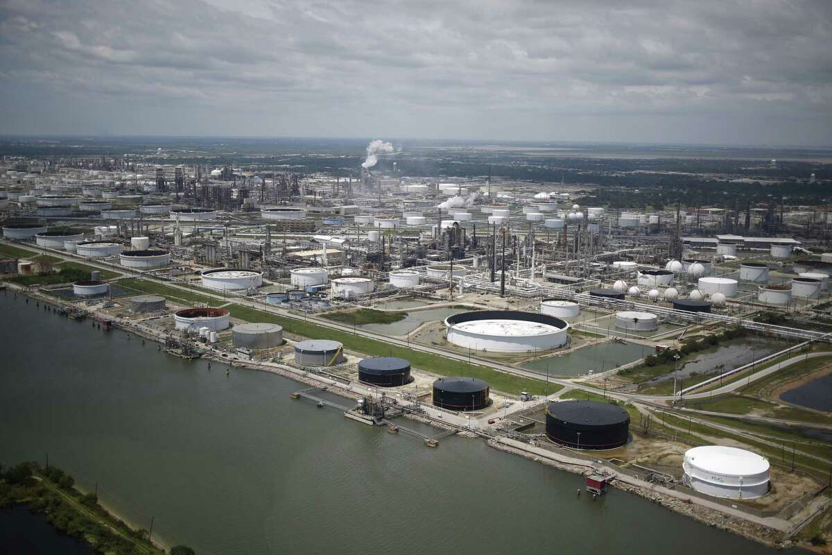 Oil refinery storage tanks stand in this aerial photograph taken above Texas City, Texas, U.S., on Wednesday, Aug. 30, 2017. Unprecedented flooding from the Category 4 storm that slammed into the state's coast last week, sending gasoline prices surging as oil refineries shut, may also set a record for rainfall in the contiguous U.S., the weather service said Tuesday. 