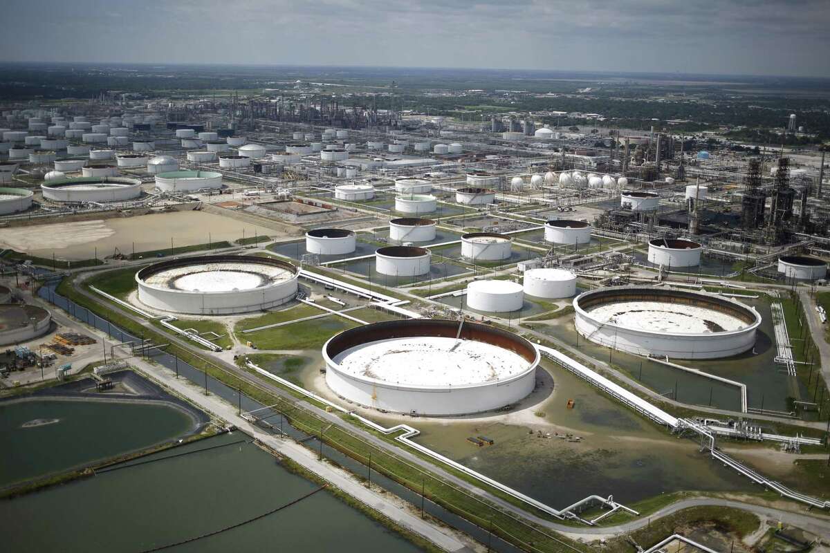 Rainwater from Hurricane Harvey surrounds oil refinery storage tanks in this aerial photograph taken above Texas City, Texas, U.S., on Wednesday, Aug. 30, 2017. Unprecedented flooding from the Category 4 storm that slammed into the state's coast last week, sending gasoline prices surging as oil refineries shut, may also set a record for rainfall in the contiguous U.S., the weather service said Tuesday. Photographer: Luke Sharrett/Bloomberg