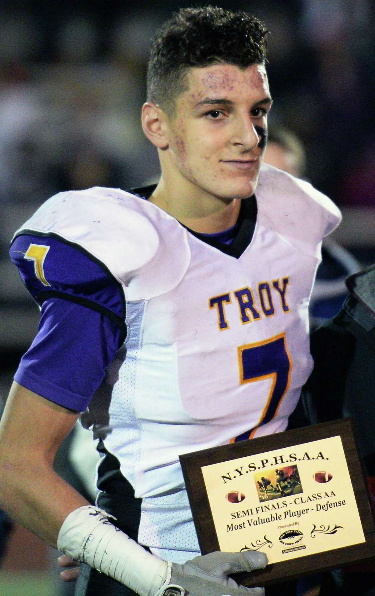 Troy #7 Joe Casale poses for photos after winning the most valuable defensive player after their win in the Class AA state semifinal game against New Rochelle at Dietz Stadium Saturday Nov. 19, 2016 in Kingston, NY. (John Carl D'Annibale / Times Union)