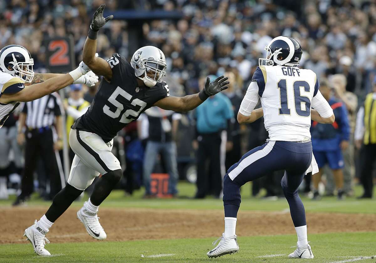 Oakland Raiders defensive end Khalil Mack (52) sacks Los Angeles Rams quarterback Jared Goff (16) during the first half of an NFL preseason football game in Oakland, Saturday, Aug. 19, 2017. (AP Photo/Rich Pedroncelli)