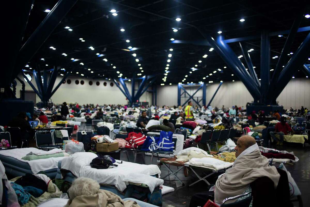 People seek shelter at the George R. Brown Convention Center in Houston.