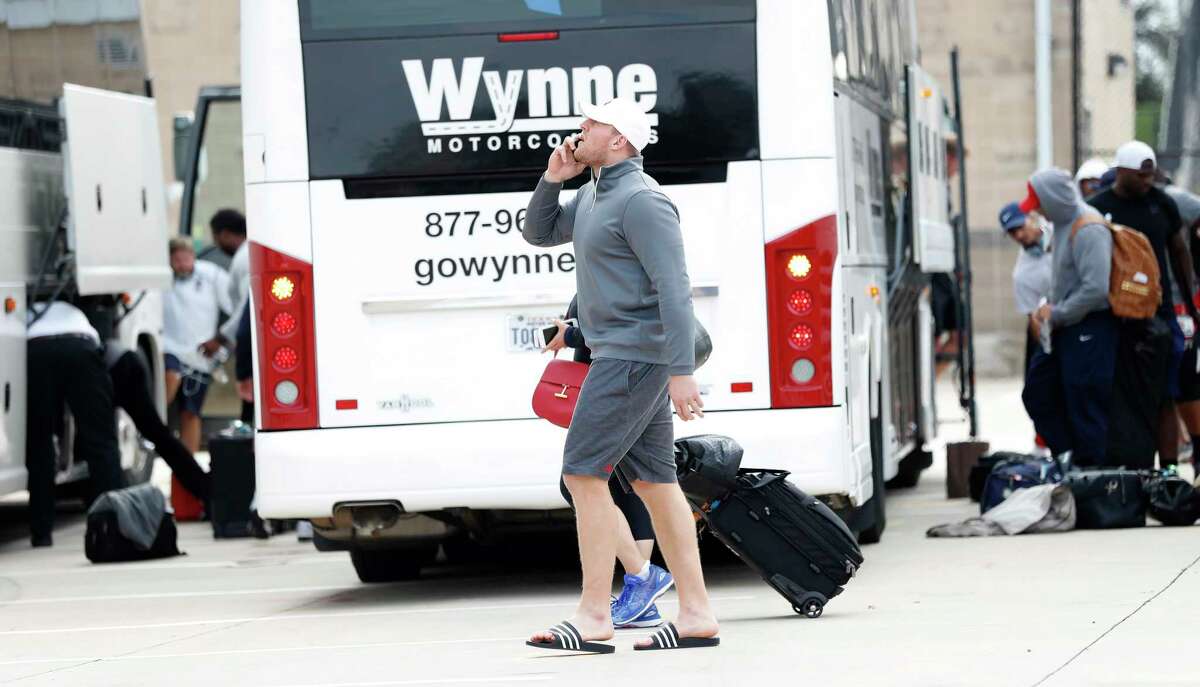 Houston Texans J.J. Watt talks on the phone after he and the team got off buses at NRG Stadium, after traveling from Dallas, Wednesday, Aug. 30, 2017, in Houston. Houston flew last week to New Orleans, then to the Dallas area, and was originally scheduled to play the Cowboys at NRG Stadium, but destruction by Hurricane Harvey and flooding from Tropical Storm Harvey. Texans were going to play the game Thursday in Dallas, but the NFL cancelled that game.