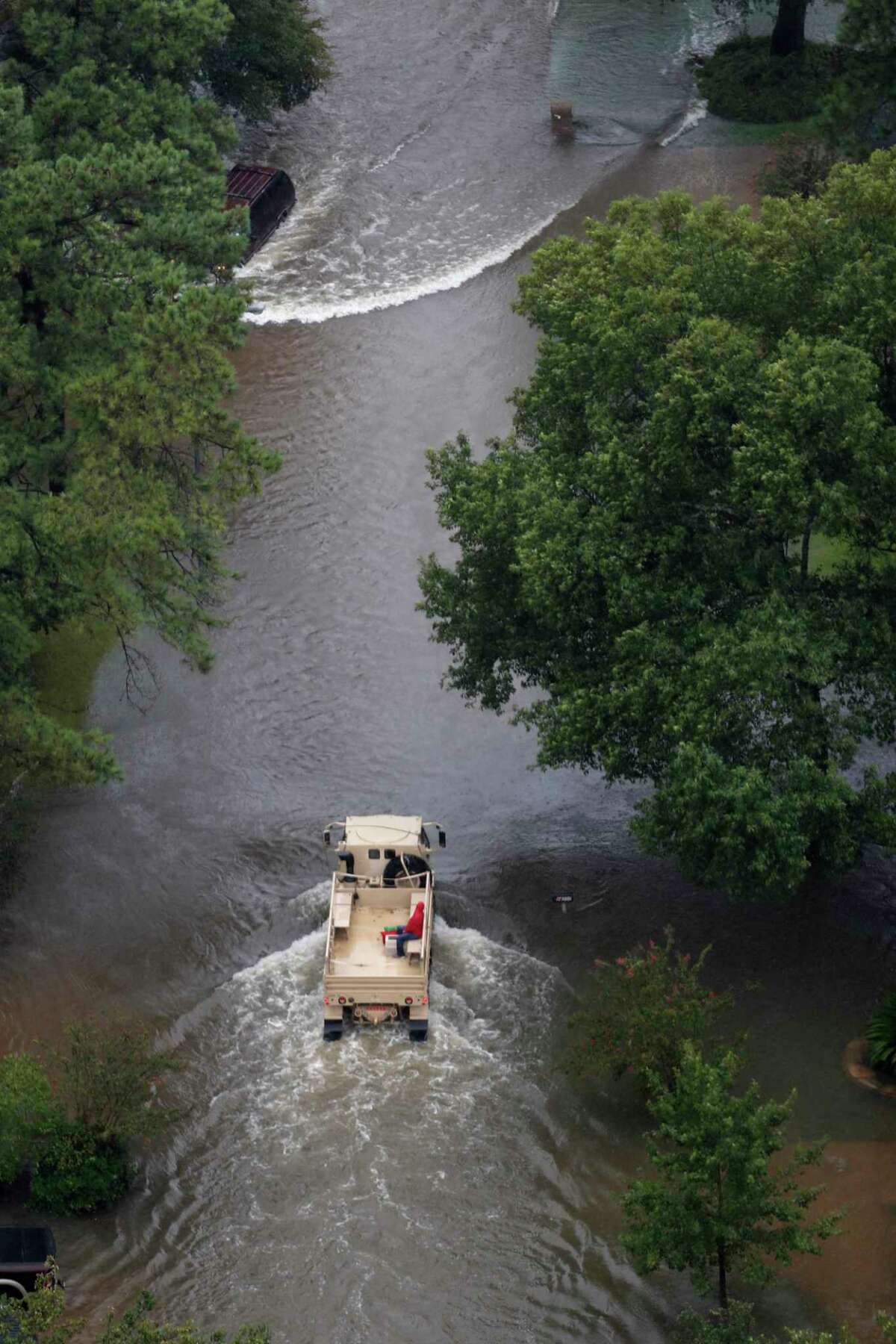 A rescue vehicle drives through a neighborhood off Cypress Creek as floodwaters rise from Tropical Storm Harvey on Tuesday, Aug. 29, 2017, in Houston. ( Brett Coomer / Houston Chronicle )