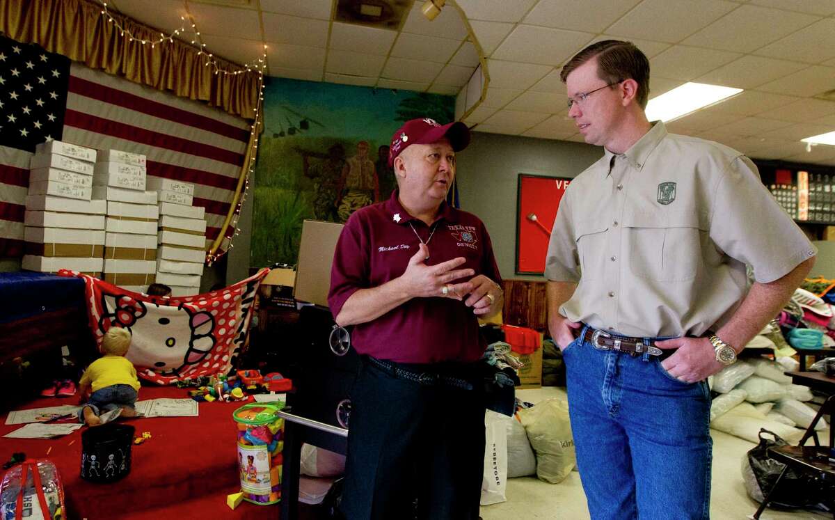 Foy Day with the VFW Post 4709, left, talks with State Rep. Will Metcalf, R-Conroe, at the Conroe Veterans of Foreign Wars Post 4709, Wednesday in Conroe.