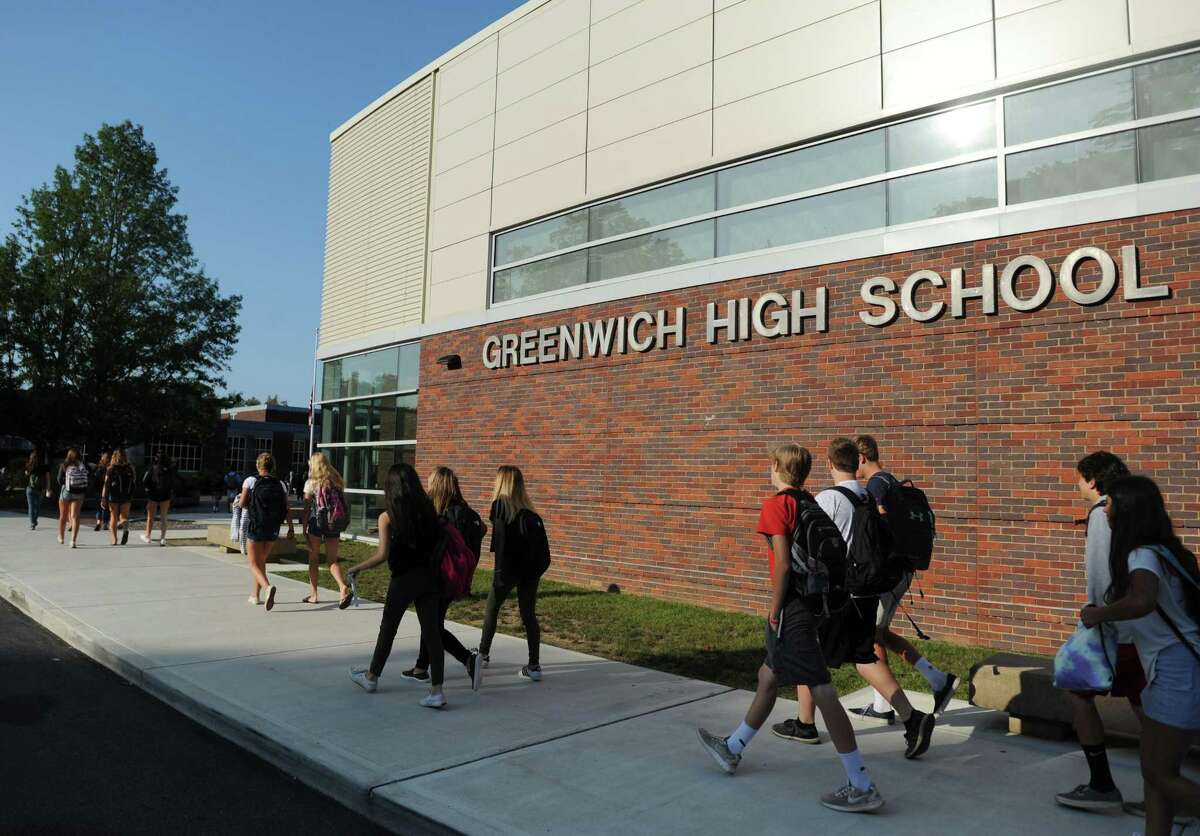 Students walk into school on the first day of the 2017-2018 school year at Greenwich High School in Greenwich, Conn. Thursday, Aug. 31, 2017.