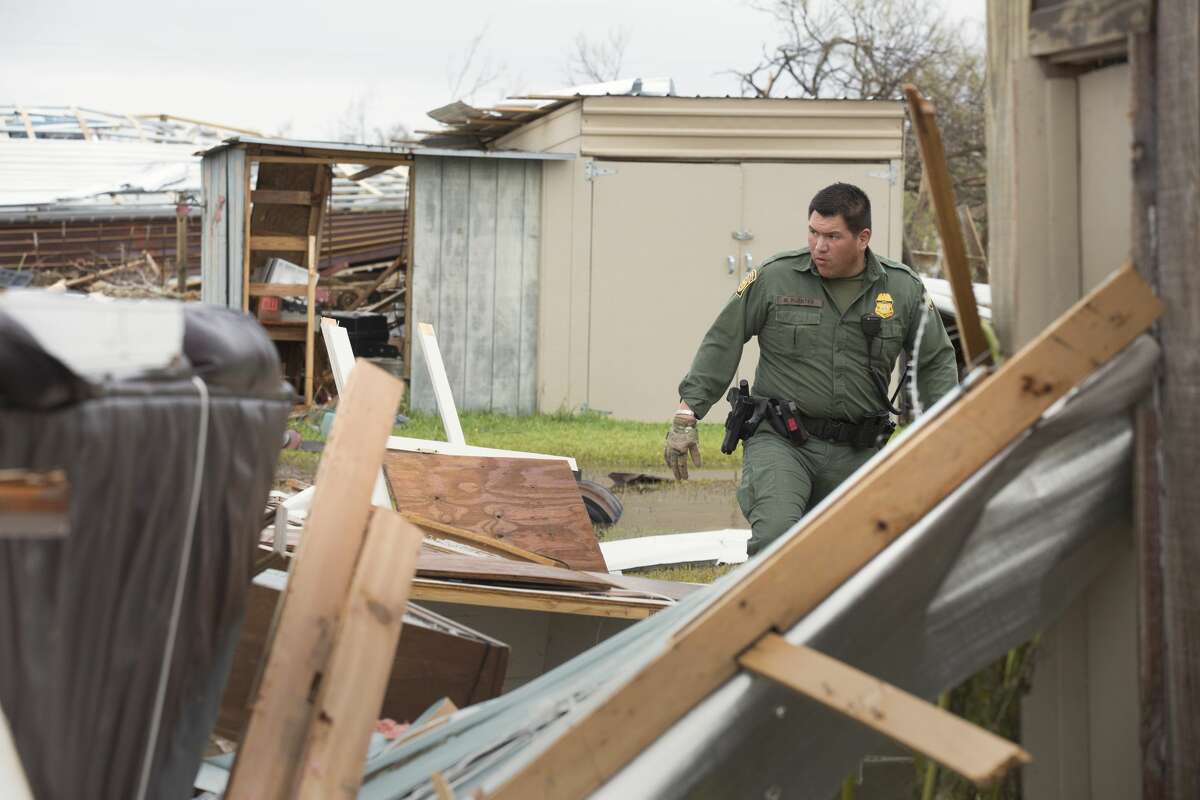 U.S Border Patrol agent Mario Fuentes searches for survivors among the rubble of a mobile home after Hurricane Harvey near Rockport, Texas, Aug. 27, 2017.