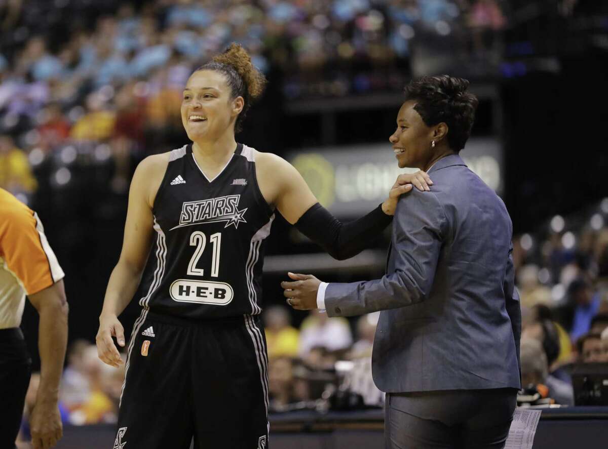 In this July 12, 2017, file photo, San Antonio Stars’ Kayla McBride laughs with head coach Vickie Johnson during the second half of a WNBA basketball game against the Indiana Fever, in Indianapolis.