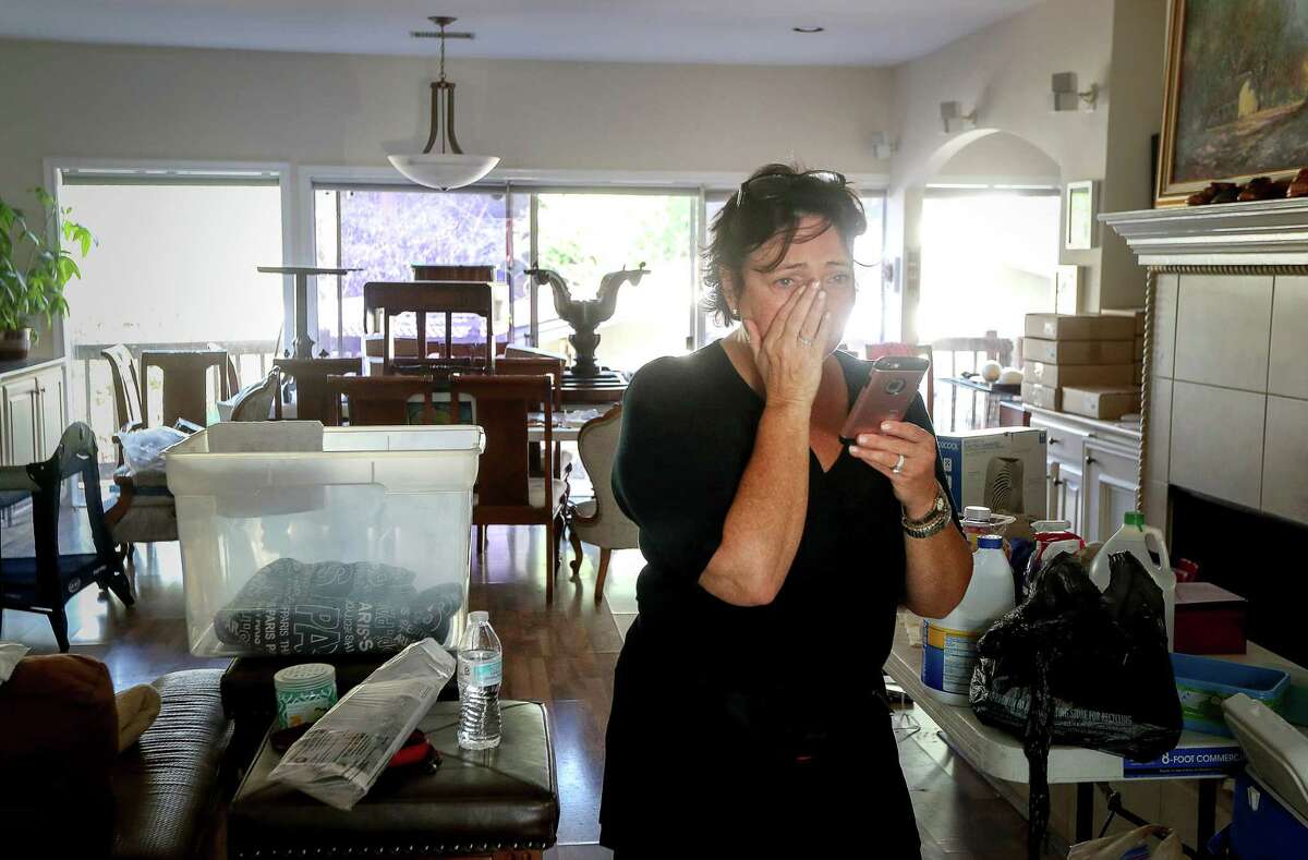 Sharlene Barris begins to cry after seeing HFD Capt. Joshua Vogel, not pictured, while firefighters were doing welfare checks on residents in the Meyerland area, Thursday, Aug. 31, 2017, in Houston. Vogel's team evacuated Barris and her husband as waters rose into their home.