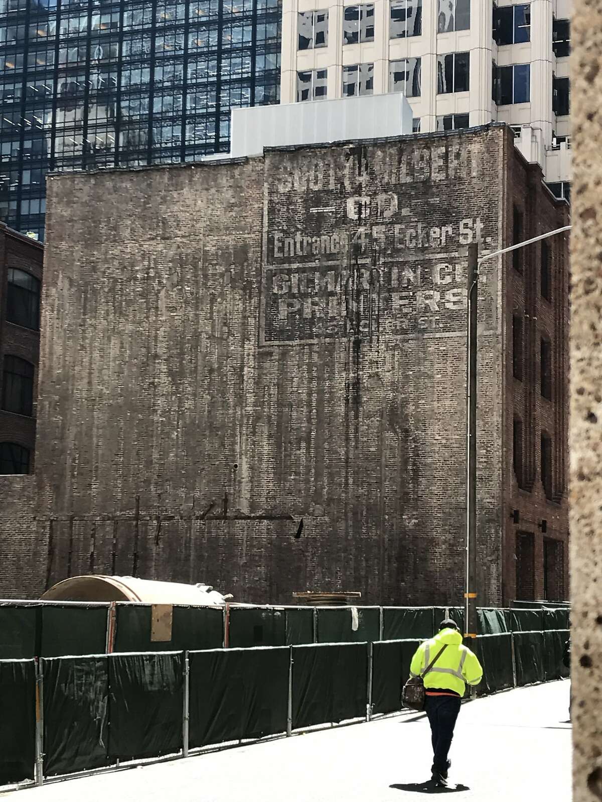 The rear wall of One Ecker as seen from 1st Street -- and the tenants' sign that was hidden for 100 years.