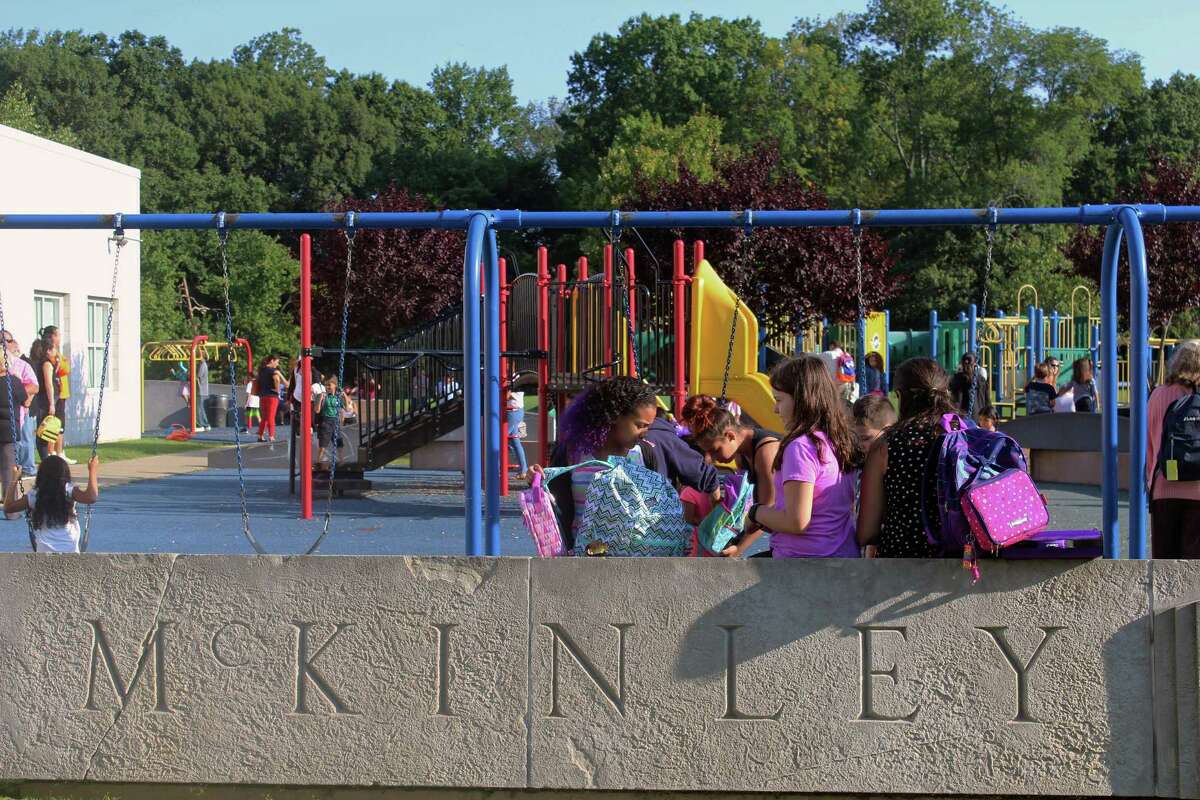 Students at McKinley School hung out at the playground Thursday, the first day of school, while waiting for the bell to ring. Fairfield,CT. 8/31/17