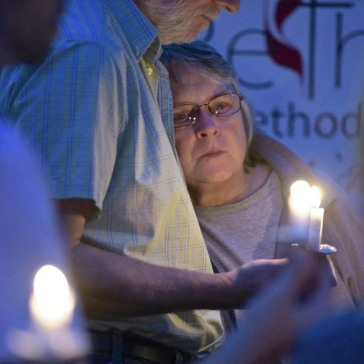 Pat O’Neil, of Bethel, leans into her husband Bob O’Neil during the HERO Project (Heroin Education to resist Opiates) candlelight vigil in honor of those who have lost their lives to overdose, O’Neil lost her son Steven to an overdose.