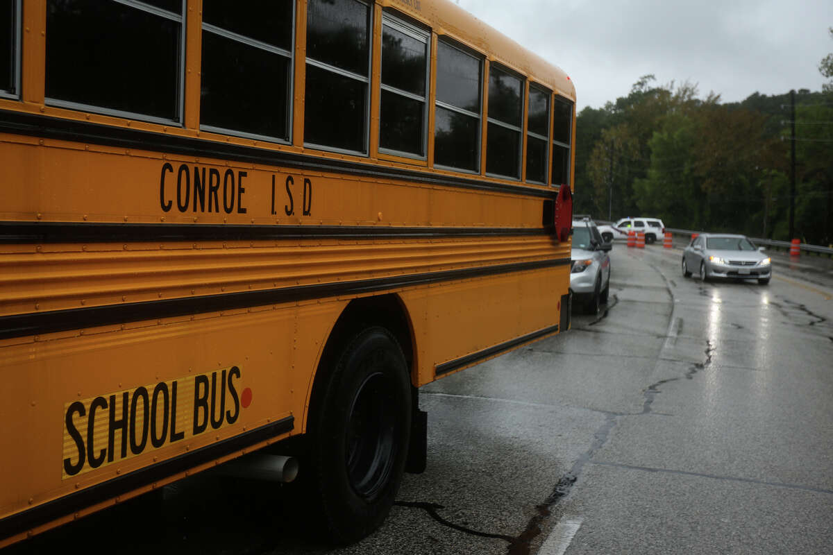 In this photo, a Conroe ISD bus stands by to take evacuees from Timber Lakes/Timber Ridge subdivision to St. Simon and Jude Catholic Church on Sunday, Aug. 27, 2017. School buses will again be used for transporting students when schools resume on Tuesday. (Michael Minasi / Chronicle)