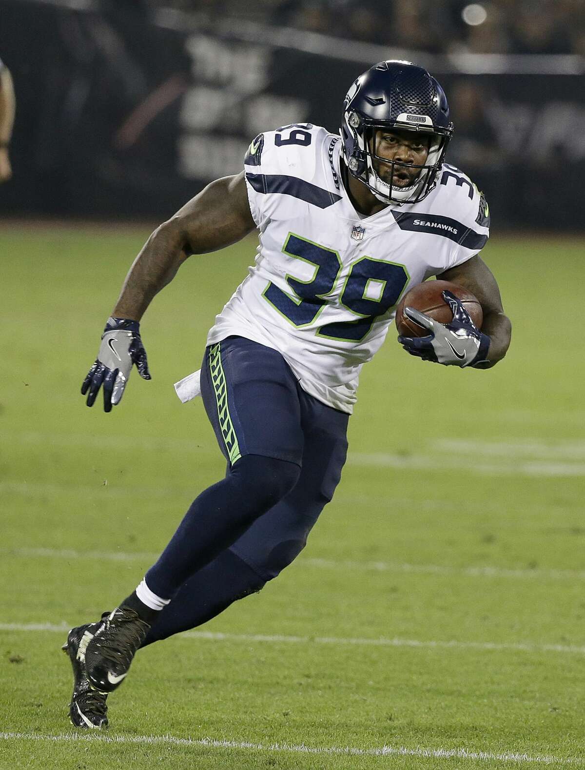 Seattle Seahawks running back Mike Davis (39) runs against the Oakland Raiders during the first half of an NFL preseason football game in Oakland, Calif., Thursday, Aug. 31, 2017. (AP Photo/Eric Risberg)
