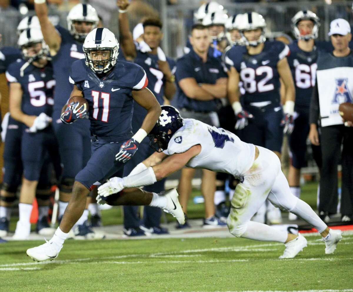 UConn football team comes from behind to beat Holy Cross