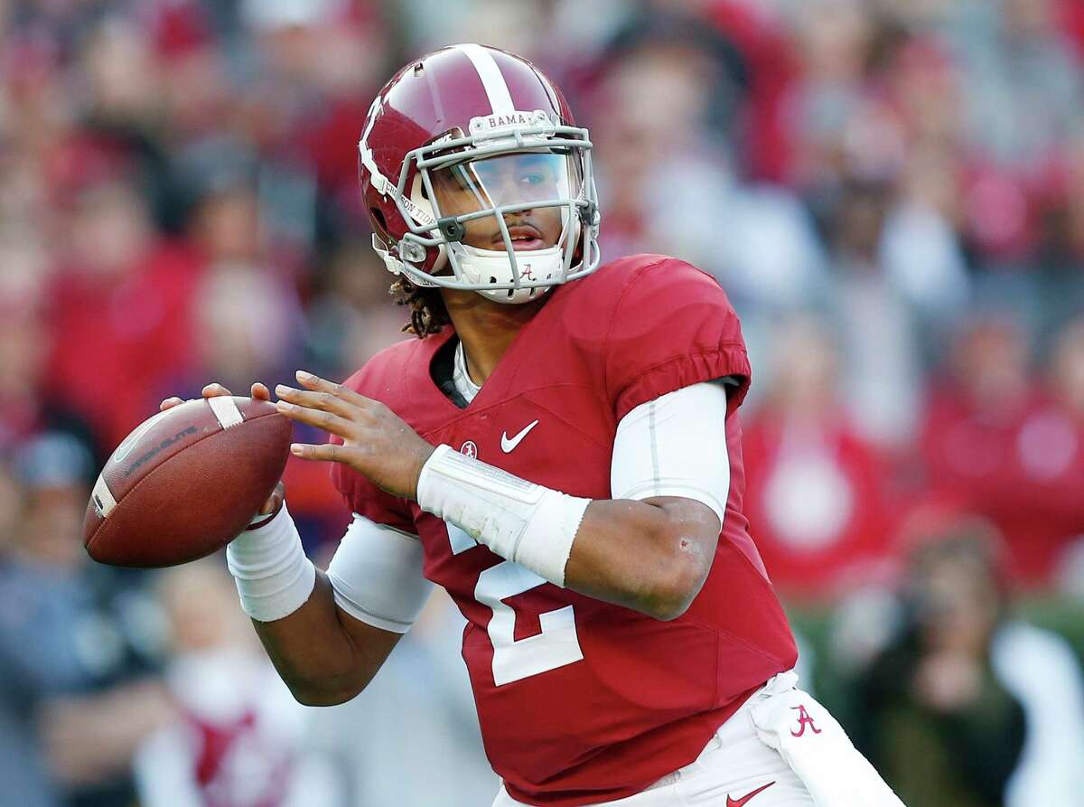 FILE - In this Nov. 26, 2016 file photo, Alabama quarterback Jalen Hurts sets back to pass during the first half of the Iron Bowl NCAA college football game against Auburn, in Tuscaloosa, Ala. Former Oklahoma University quarter back Jamelle Holieway dazzled the college football world as a true freshman who mastered OklahomaÂ?’s dynamic wishbone attack and led the Sooners to the 1985 national championship. Now, Alabama true freshman Hurts is on the cusp of becoming the first true freshman quarterback since Holieway to win it all. (AP Photo/Brynn Anderson, File)