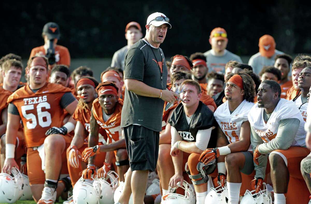 Coach Tom Herman gets the attention of players early with a talk after warm up as the Longhorns begin their fall football practice at Frank Denius Fields at the University of Texas on July 31, 2017.