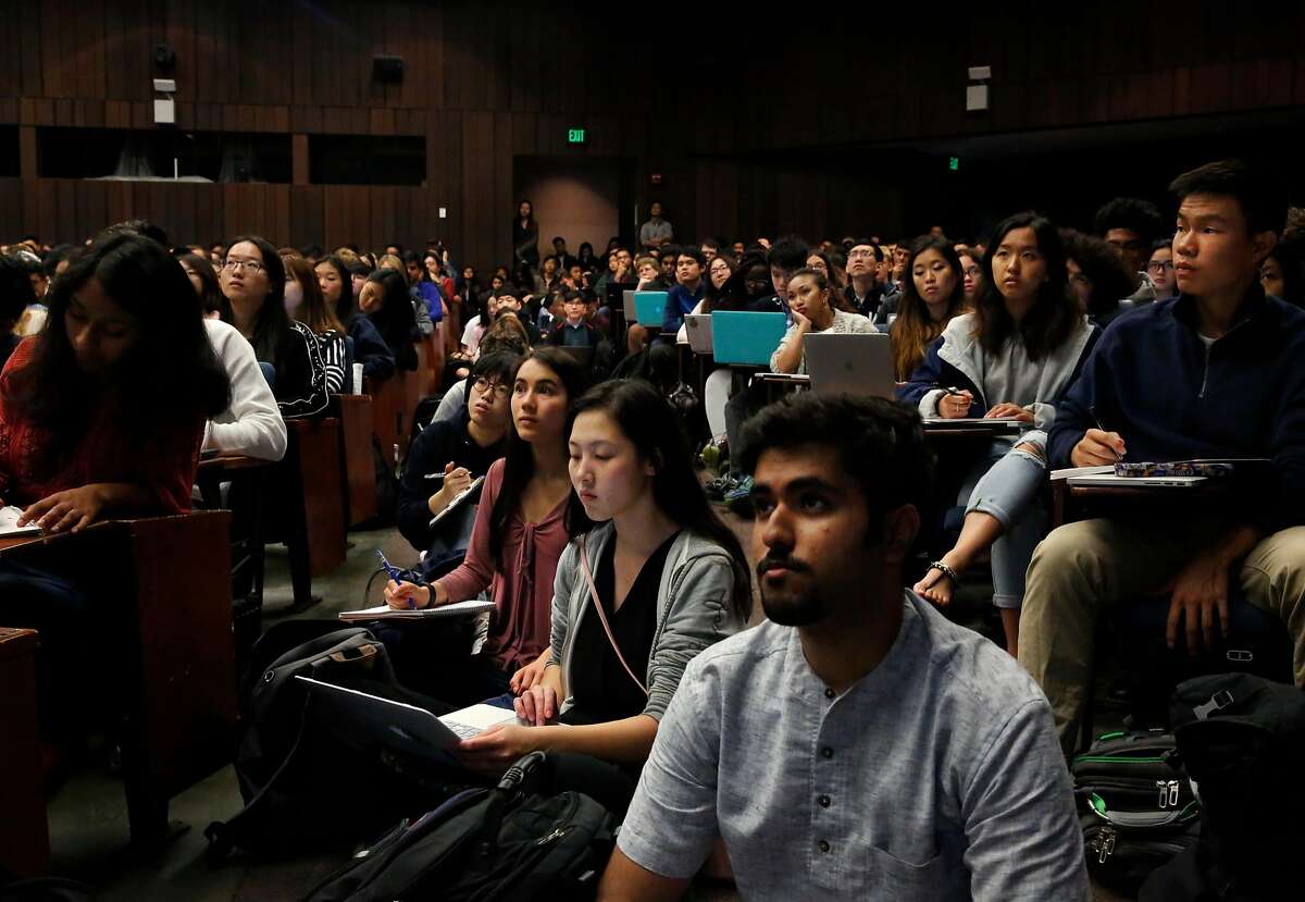 Students overflow into the aisles, from front right to back left, freshman Pranav Bhasin, electrical engineering, computer science major, freshman Shirley Li, bio engineering major, freshman Sasha Manghise, bio engineering major, and freshman Jinxin Xiong, mathematics major during the first day of the Foundations of Data Science course at UC Berkeley campus August 23, 2017 in Berkeley, Calif.