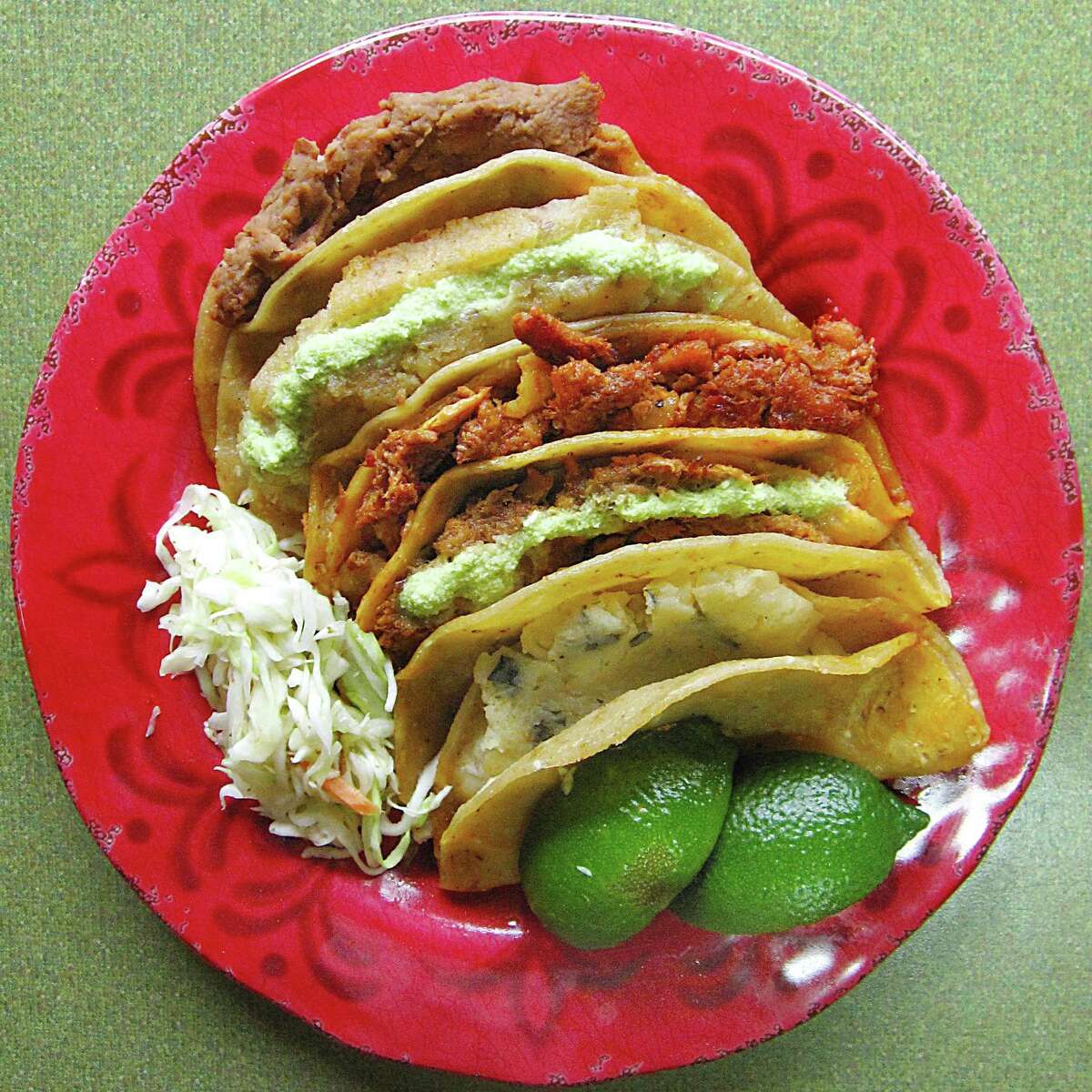 An order of five steamed tacos al vapor with cabbage escabeche from Regios Tacos Al Vapor.