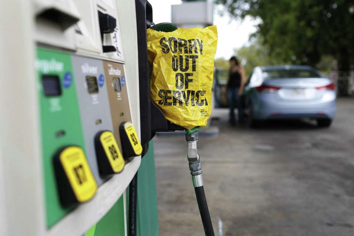 A "Sorry out of Service" sign is placed on one of the gas pumps at a gas station in Athens, Ga., on Friday, Sept. 1, 2017. Gasoline prices in the U.S. have risen to new high amid continuing fears of shortages in Texas and other states after Hurricane Harvey's strike. (Joshua L. Jones/Athens Banner-Herald via AP)