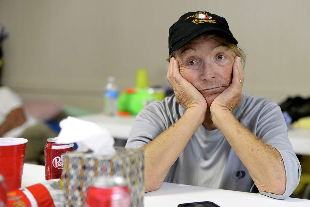 Joann Wheeler sits at a table in the community center in Sour Lake on Friday. Wheeler said water was waist deep in her home. Photo taken Friday 9/1/17 Ryan Pelham/The Enterprise