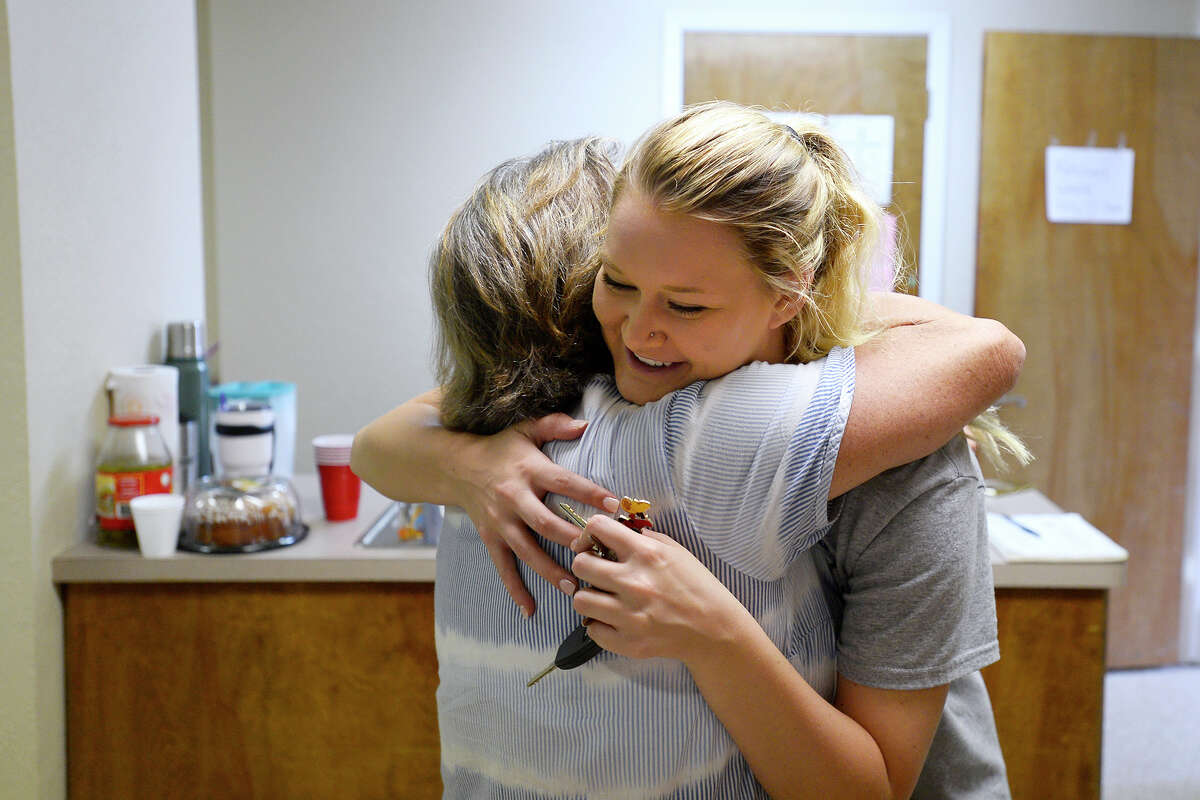 Renee Robinson hugs Hannah Gieseke at the shelter in the community center in Sour Lake on Friday. Photo taken Friday 9/1/17 Ryan Pelham/The Enterprise