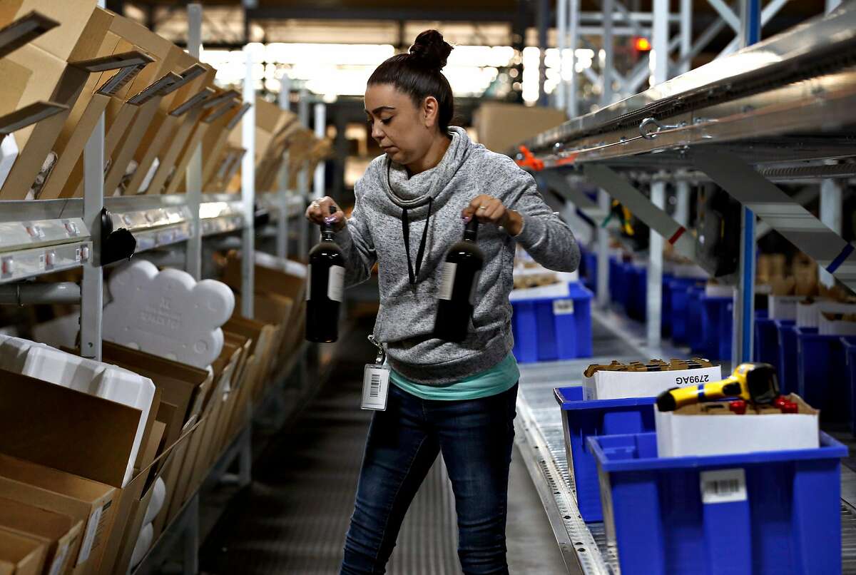 Veresa Anderson completes a customer's order at the Wine Direct fulfillment and distribution center in American Canyon, Calif. on Tuesday, Aug. 29, 2017.