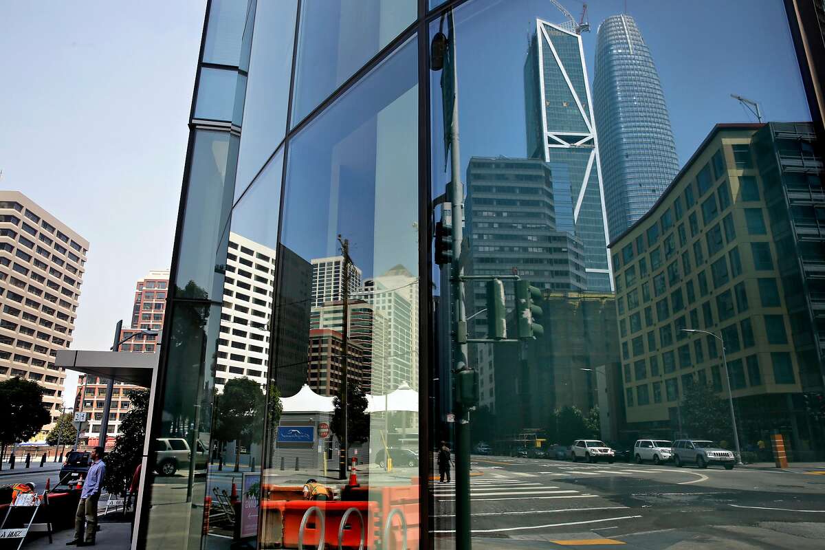 Salesforce Tower is reflected in the windows of the Lumina Towers along Folsom between Beale and Main streets in downtown San Francisco, Ca. on Fri. September 1, 2017.