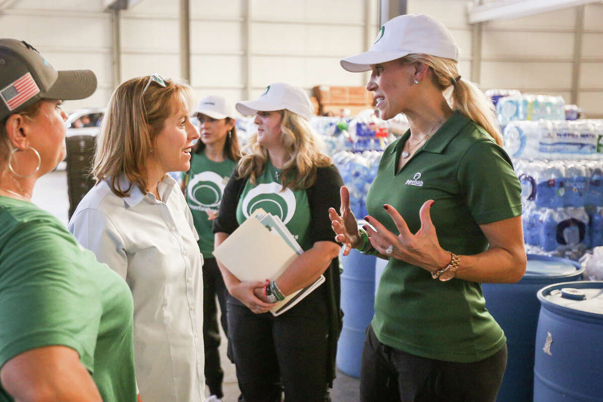 Missy Herndon, Interfaith of The Woodlands President and CEO, right, speaks with Debra Sukin, Interfaith of The Woodlands Chairman, left, on Friday, Sept. 1, 2017, at Falcon Steel America's warehouse in Conroe. Falcon Steel America donated the space to serve as a central drop off location for supplies to help Montgomery County residents affected by Tropical Storm Harvey.