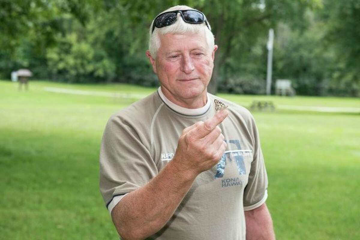 Dave Haag is holds the butterfly he purchased in memory of his wife, Karen. Haag attended the Butterfly in the Park event held at Chippewassee Park in Midland. (Photo provided)