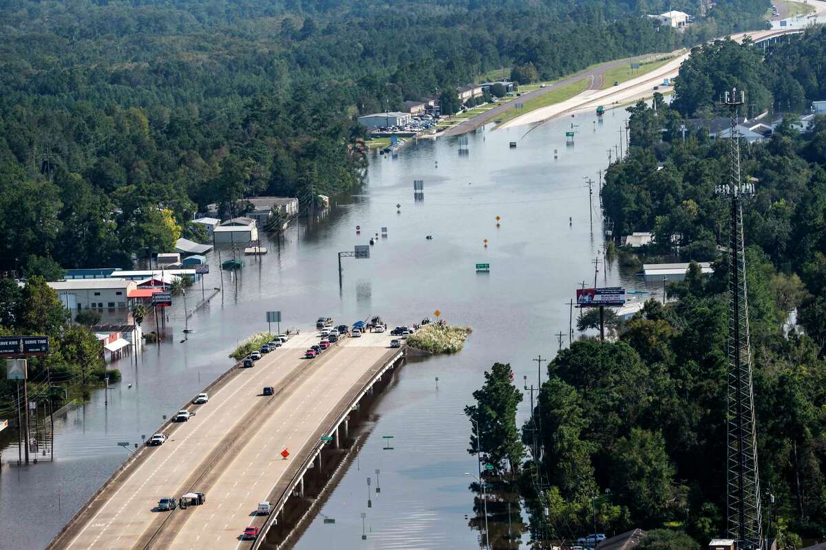 Highway 96 sits submerged by floodwaters from Tropical Storm Harvey on Friday, Sept. 1, 2017, in Lumberton, Texas. ( Brett Coomer / Houston Chronicle )